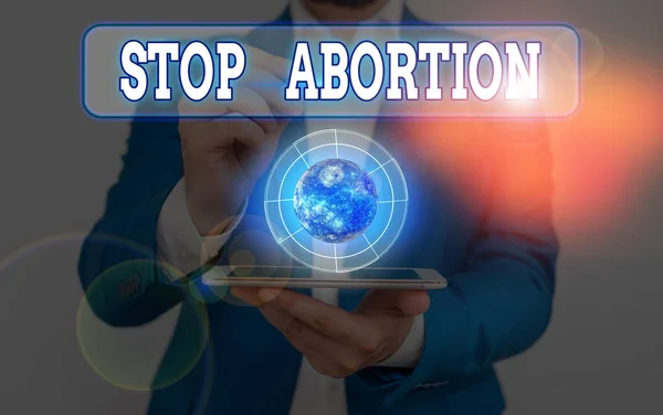 Koncepční rukopis ukazující Zastavit potrat. Obchodní foto text k zastavení lékařské procedury, která sloužila k ukončení těhotenství Prvky tohoto obrazu poskytnuté NASA. — Stock fotografie