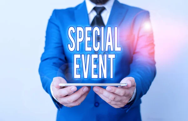 Word writing text Special Event. Business concept for activity or gathering that is planned for a special purpose Businessman in blue suite with a tie holds lap top in hands.