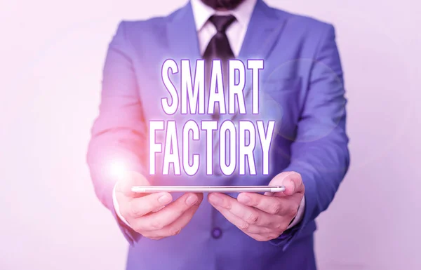 Word writing text Smart Factory. Business concept for A highly digitized and connected production facility Businessman in blue suite with a tie holds lap top in hands.