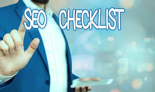 Texto de escritura de palabras Seo Checklist. Concepto de negocio para la lista de elementos necesarios para optimizar el motor de búsqueda . —  Fotos de Stock