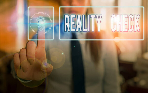 Handwriting text Reality Check. Concept meaning one is reminded of the state of things in the real world.