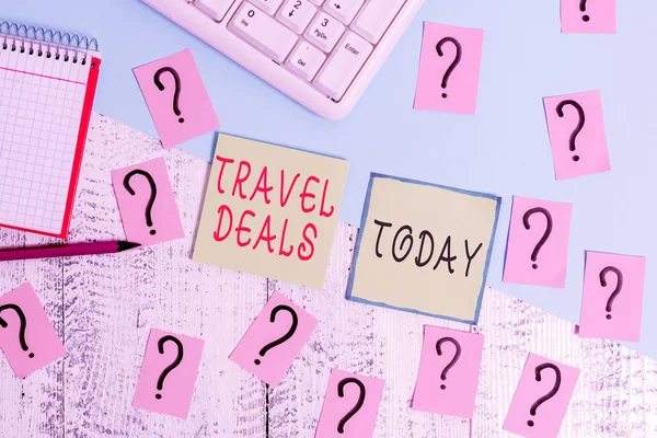 Handwriting text writing Travel Deals. Concept meaning holiday organized by a travel company and pay fixed price Writing tools, computer stuff and math book sheet on top of wooden table. — Stock Photo, Image