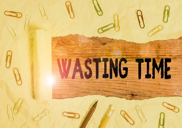 Text sign showing Wasting Time. Conceptual photo act of spending time doing something that is unnecessary.