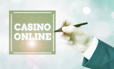 Casino Online 'ı gösteren kavramsal el yazısı. İş fotoğrafçıları kumarbazlar internet üzerinden kumarhane oyunları oynayabilir ve bahis oynayabilirler.