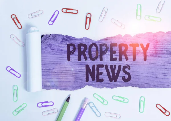 Writing note showing Property News. Business photo showcasing The buying or selling, and renting of land or building.