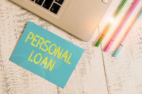 Text sign showing Personal Loan. Conceptual photo unsecured loan taken by individuals from a financial company Trendy metallic laptop blank sticky pad three pens lying vintage table. — Stock Photo, Image
