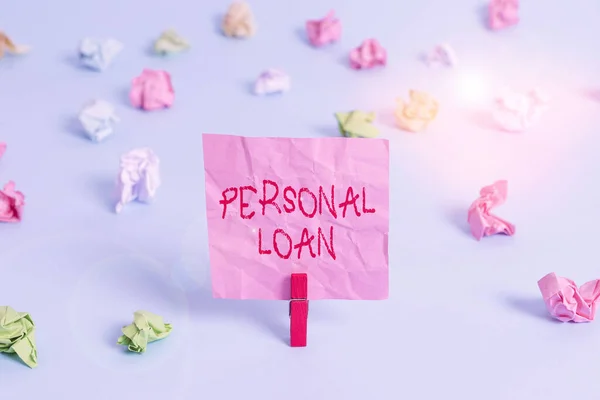 Writing note showing Personal Loan. Business photo showcasing unsecured loan taken by individuals from a financial company Colored crumpled rectangle shaped reminder paper light blue background.