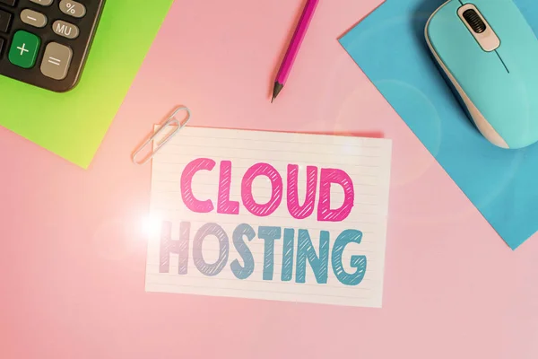 Writing note showing Cloud Hosting. Business photo showcasing the alternative to hosting websites on single servers Electronic mouse calculator paper sheets clip marker colored background.