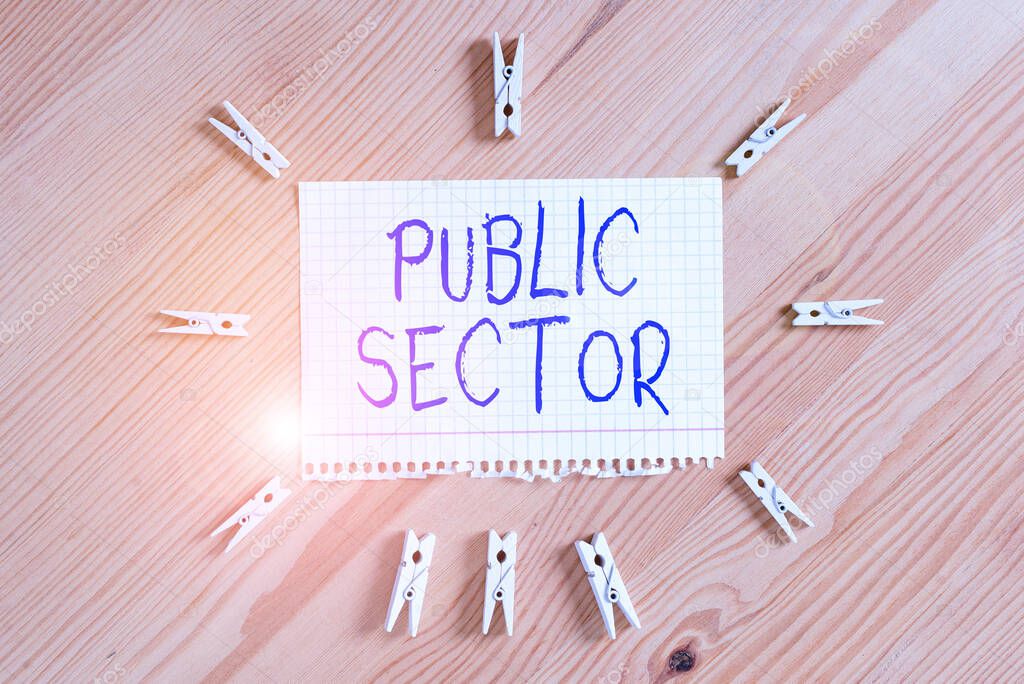 Conceptual hand writing showing Public Sector. Business photo showcasing the part of an economy that is controlled by the state Colored crumpled papers wooden floor background clothespin.