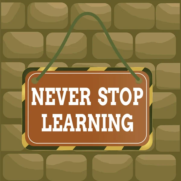 Handwriting text Never Stop Learning. Concept meaning keep on studying gaining new knowledge or materials Board attached string color black yellow frame empty blank rectangle shape. — Stock Photo, Image