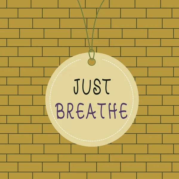 Text sign showing Just Breathe. Conceptual photo Take a break in a stressful day To overcome difficulties Relax Badge circle label string rounded empty tag colorful background small shape. — Stock Photo, Image