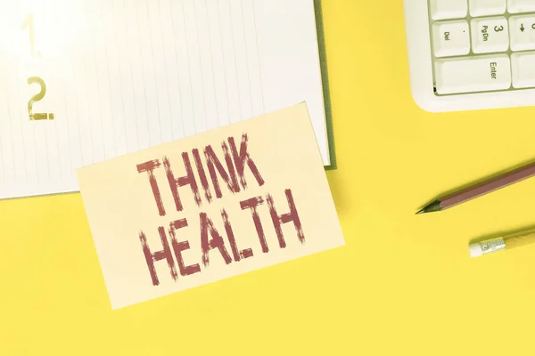 Segno di testo che mostra Think Health. Stato fotografico concettuale di completo benessere fisico mentale e sociale Carta arancione vuota con spazio di copia sul tavolo giallo . — Foto Stock