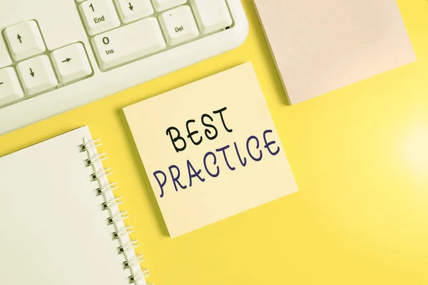 Writing note showing Best Practice. Business photo showcasing commercial procedures that are accepted prescribed being correct Empty papers with copy space on yellow background table.