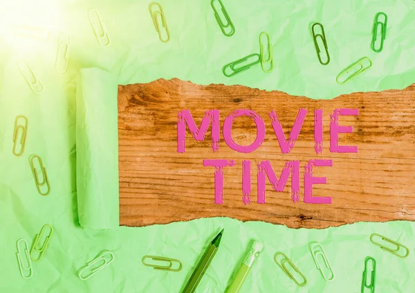 Handwriting text writing Movie Time. Concept meaning the scheduled or actual time at which a show or film begins.