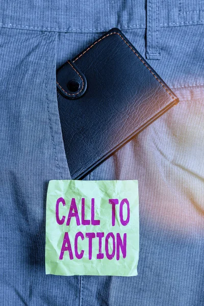 Conceptual hand writing showing Call To Action. Business photo showcasing exhortation do something in order achieve aim with problem Small wallet inside trouser front pocket near notation paper. — Stock Photo, Image