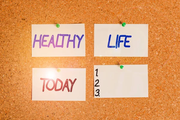 Handwriting text writing Healthy Life. Concept meaning one that helps to keep and improve showings is health or condition Corkboard color size paper pin thumbtack tack sheet billboard notice board. — Stock Photo, Image