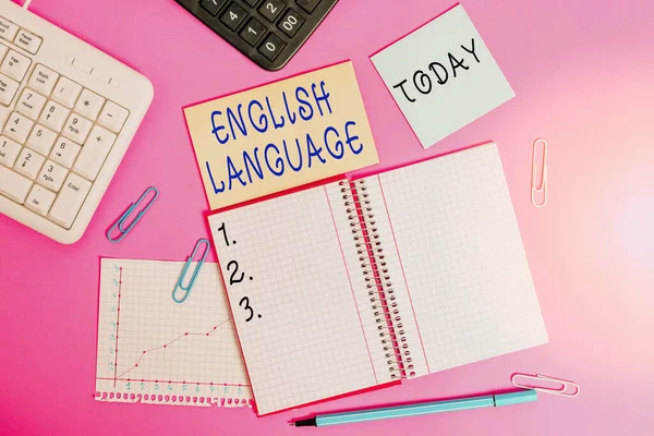 Conceptual hand writing showing English Language. Business photo showcasing third spoken native lang in world after Chinese and Spanish Writing equipments and computer stuff placed on wooden table. — Stock Photo, Image