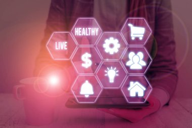 Live Health 'i gösteren bir not yazıyorum. Gösterimlerin korunmasına ve iyileştirilmesine yardımcı olan iş fotoğrafı sergisi sağlık veya durumdur.