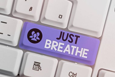 Writing note showing Just Breathe. Business photo showcasing Take a break in a stressful day To overcome difficulties Relax.