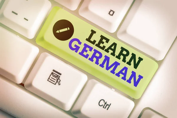 Writing note showing Learn German. Business photo showcasing get knowledge or skill in speaking and writing German language.