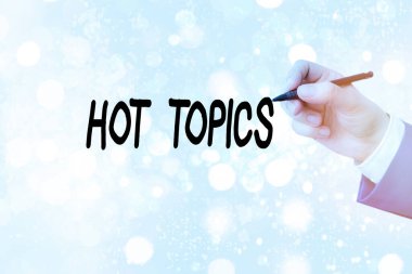 Hot Topics 'i gösteren kavramsal el yazısı. Bir sürü gösterilen ve tartışılan iş fotoğrafı konusu.