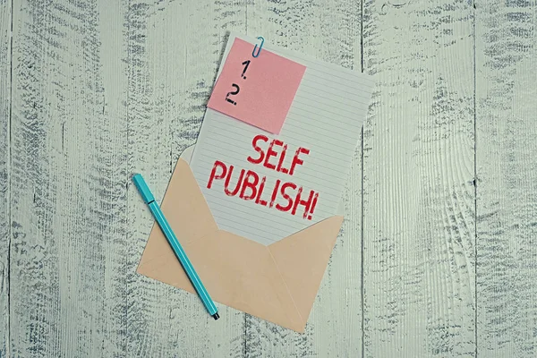 Text sign showing Self Publish. Conceptual photo writer publish piece of ones work independently at own expense Envelope blank sheet letter paper sticky note ballpoint wooden background.