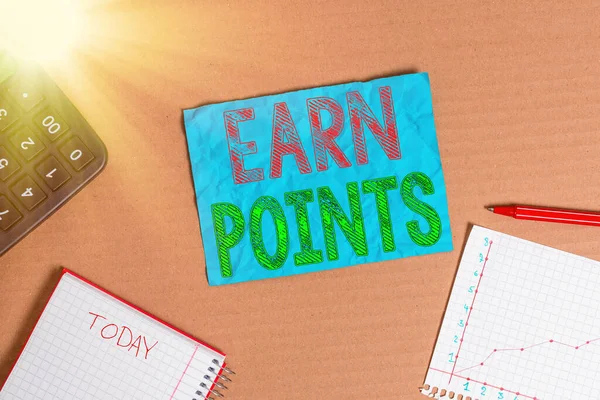 Text sign showing Earn Points. Conceptual photo collecting scores in order qualify to win big prize Cardboard paperboard notebook office study supplies chart reminder paper.
