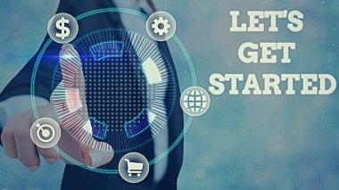 Hadi Başlayalım 'ı gösteren bir not yazıyorum. Başlattığınız bir şey üzerinde çalışmaya ya da yapmaya başlamak için iş fotoğrafı sergisi.