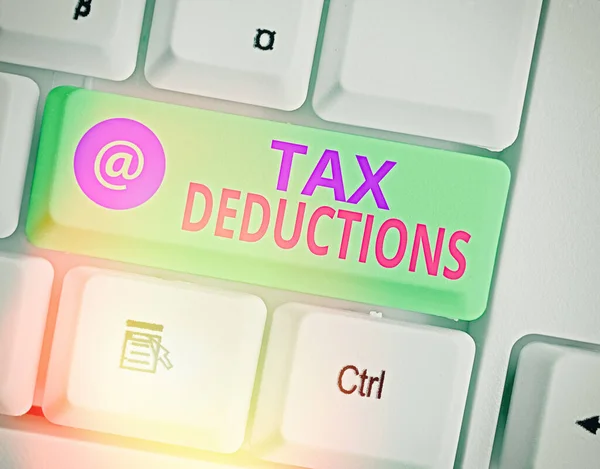 Writing note showing Tax Deductions. Business photo showcasing an amount or cost that subtracted from someone income. — Stock Photo, Image