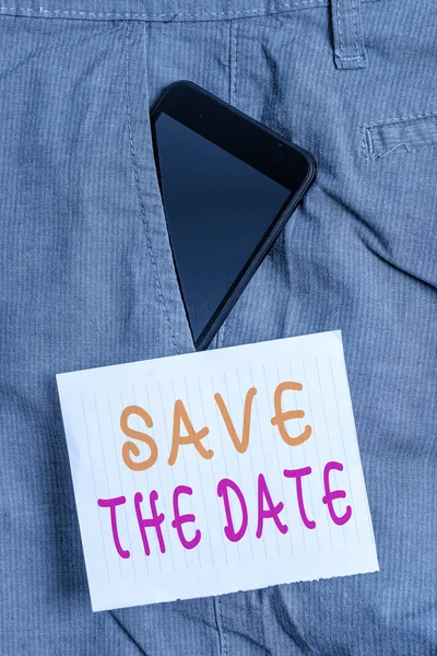 Writing note showing Save The Date. Business photo showcasing Organizing events well make day special event organizers Smartphone device inside trousers front pocket note paper. — Stock Photo, Image