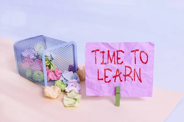 Writing note showing Time To Learn. Business photo showcasing the need to get knowledge or understanding of facts and ideas Trash bin crumpled paper clothespin reminder office supplies.