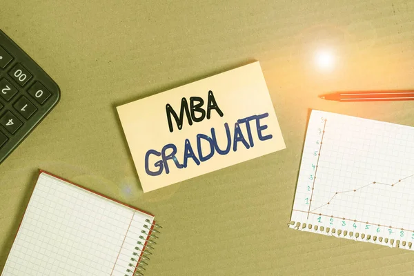 Handwriting text Mba Graduate. Concept meaning masters is degree with specialization in business administration Cardboard paperboard notebook office study supplies chart reminder paper.