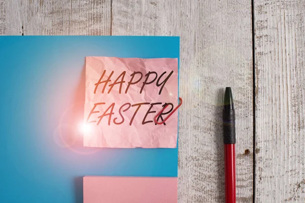 Text sign showing Happy Easter. Conceptual photo the Christian celebration of the Resurrection of Christ Wrinkle paper and cardboard plus stationary placed above wooden background.