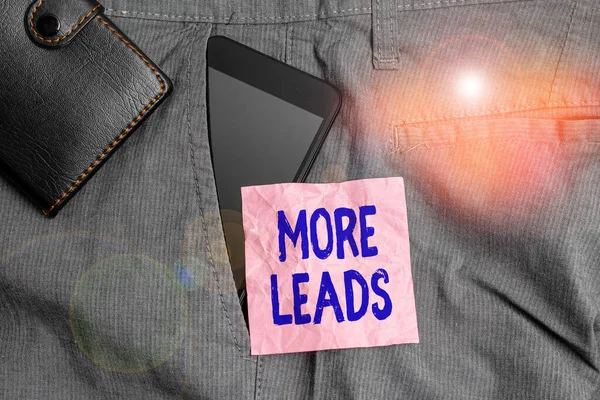 Text sign showing More Leads. Conceptual photo initiation of consumer interest or enquiry into product Smartphone device inside trousers front pocket with wallet and note paper.