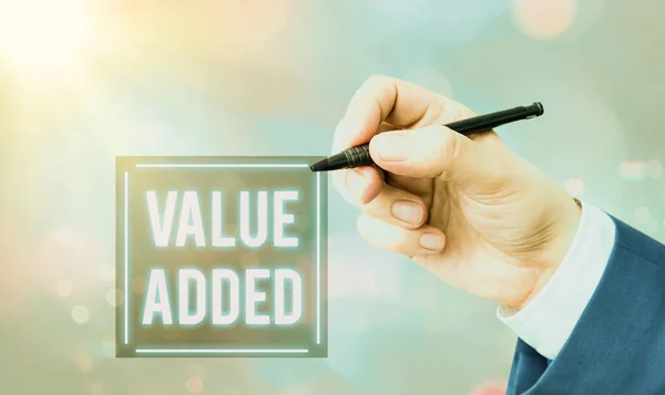 Conceptual hand writing showing Value Added. Business photo text the extra value created over and above the original value. — Stock Photo, Image