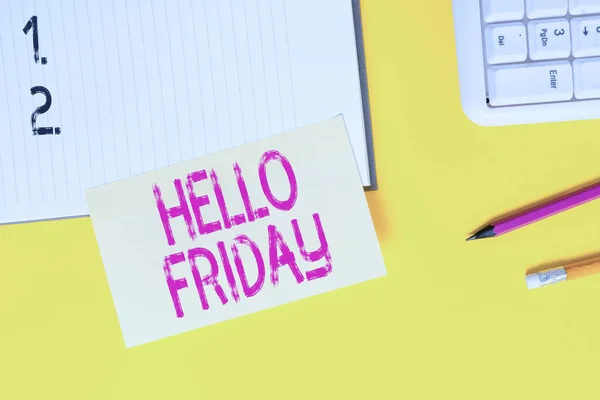 Text sign showing Hello Friday. Conceptual photo used to express happiness from beginning of fresh week Empty orange paper with copy space on the yellow table.