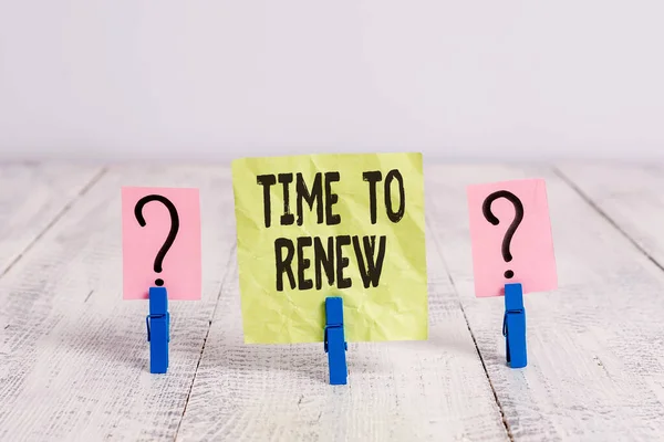 Text sign showing Time To Renew. Conceptual photo extending the period of time when something is valid Scribbled and crumbling sheet with paper clips placed on the wooden table.