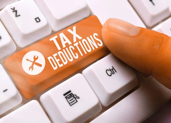 Text sign showing Tax Deductions. Conceptual photo an amount or cost that subtracted from someone income. — Stock Photo, Image