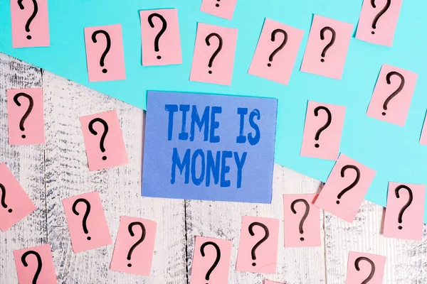 Conceptual hand writing showing Time Is Money. Business photo showcasing time is a valuable resource Do things as quickly as possible Crumbling papers with thick cardboard on the wooden table.