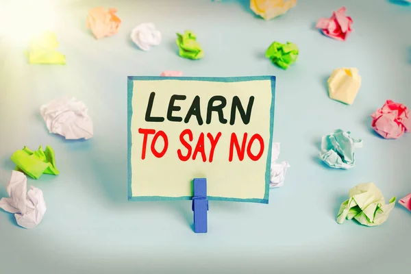 Conceptual hand writing showing Learn To Say No. Business photo showcasing decline or refuse few things before you destroy yourself Colored crumpled papers empty reminder blue floor clothespin. — Stock Photo, Image