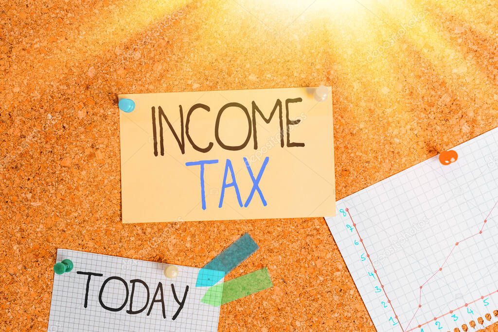 Writing note showing Income Tax. Business photo showcasing Annual charge levied on both earned and unearned income Corkboard size paper thumbtack sheet billboard notice board.