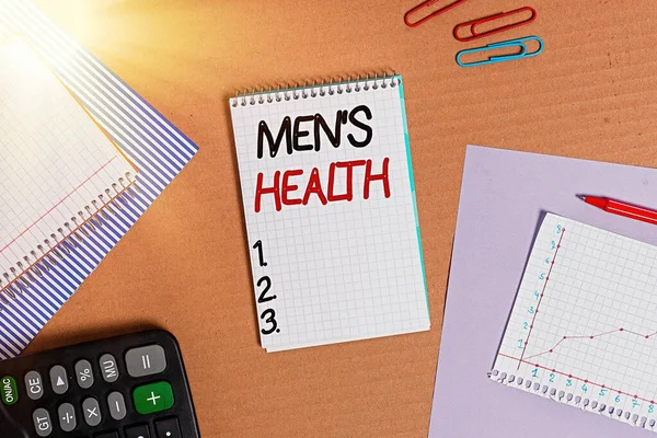 Text sign showing Mens Health. Conceptual photo state of complete physical mental and social well being by man Striped paperboard notebook cardboard office study supplies chart paper.