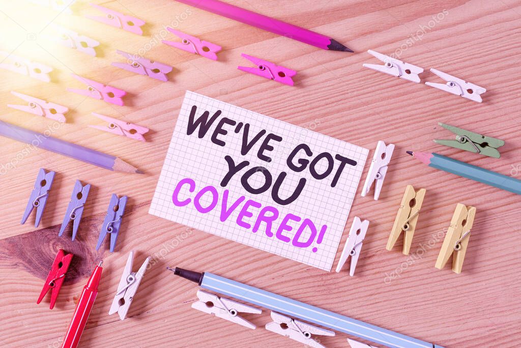 Conceptual hand writing showing We have Got You Covered. Business photo text have done gotten or provided whatever needed Colored crumpled papers wooden floor background clothespin.