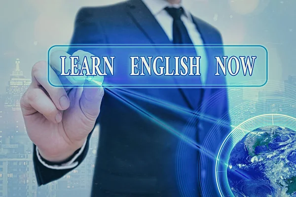 Word writing text Learn English Now. Business concept for gain or acquire knowledge and skill of english language Elements of this image furnished by NASA.
