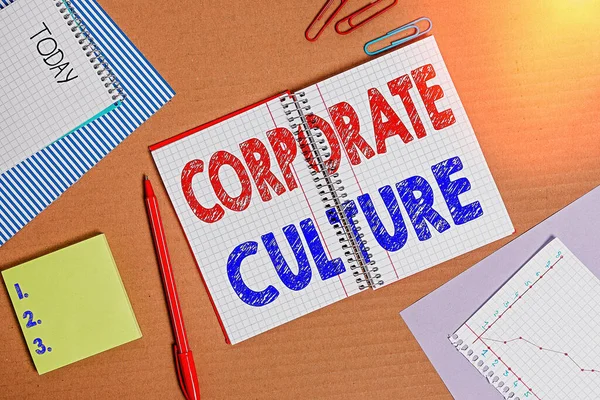 Word writing text Corporate Culture. Business concept for pervasive values and attitudes that characterize a company Striped paperboard notebook cardboard office study supplies chart paper.