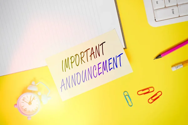Writing note showing Important Announcement. Business photo showcasing spoken statement that tells showing about something Empty orange paper with copy space on the yellow table.