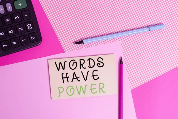 Writing note showing Words Have Power. Business photo showcasing as they has ability to help heal hurt or harm someone writing equipments and plain note paper placed on the table.