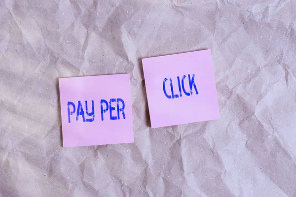 Writing note showing Pay Per Click. Business photo showcasing internet marketing in which payment is based on clickthroughs Papercraft desk square spiral notebook office study supplies.
