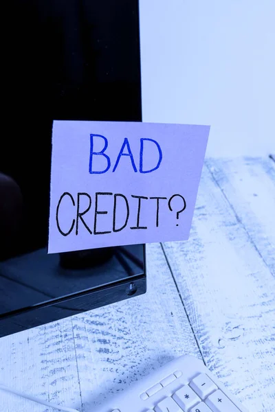 Text sign showing Bad Creditquestion. Conceptual photo inability to repay a debt on time and in full Notation paper taped to black computer monitor screen near white keyboard. — Stock Photo, Image