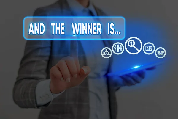 Conceptual hand writing showing And The Winner Is. Business photo text announcing a demonstrating or thing that wins something. — Stockfoto